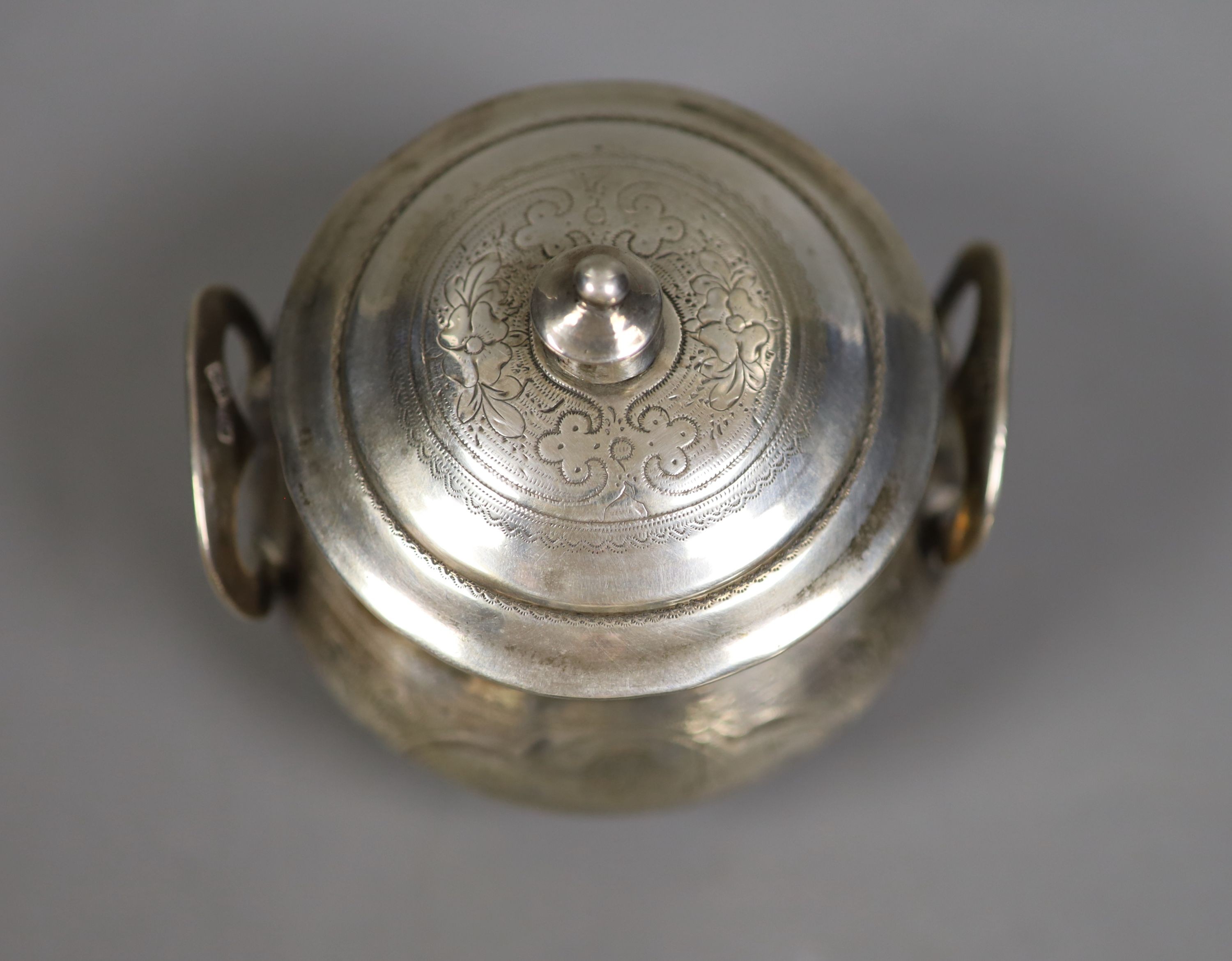 A late 19th century Russian 84 zolotnik engraved two handled pot and cover, assay master B.C, dated 1873, height 10cm, 7oz.